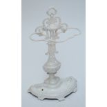 A white painted cast iron stick/umbrella stand with floral decorated baluster shaped stem,