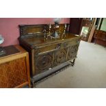 A 1920's/30's oak sideboard with raised back, length 152cm.