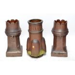 Three Victorian terracotta glazed chimney pots.