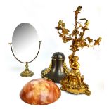 A brass figural table lamp with six floral and foliate branches issuing from a cornucopia held by a