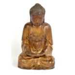 A Chinese late Ming gilt carved wooden figure of seated Buddha Amitabha, height 22.5cm.