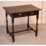 A c1900 oak hall table, one central drawer on turned supports and turned cross-stretcher.