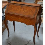 A 20th century Italian inlaid bureau with floral decoration on tapering cabriole supports,