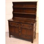 An Ercol 'Old Colonial' elm dresser with plate rack,