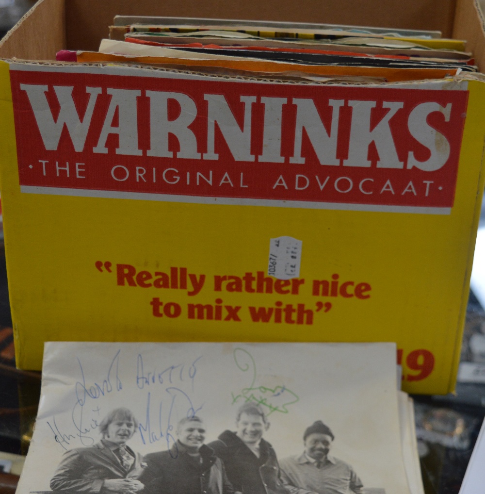 A programme signed by the Spinners and Cliff Hall and a further quantity of singles to include Jim