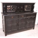 A priory-style dark oak sideboard, width approx 150cm.