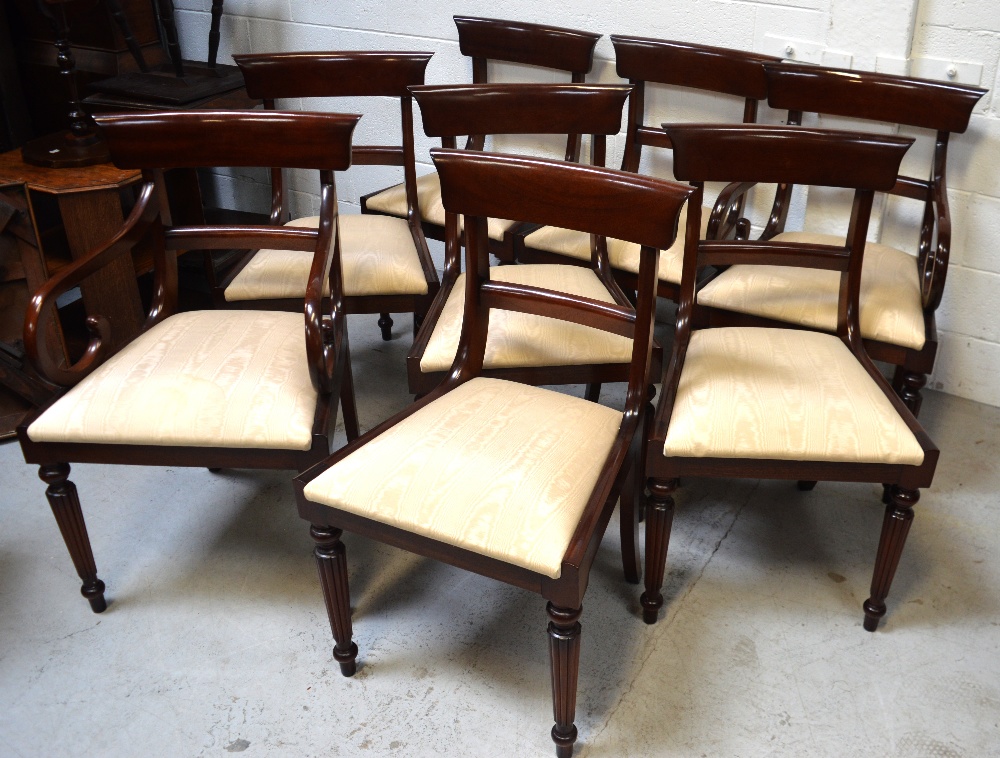 A set of eight mahogany Sheraton-style reproduction dining chairs (two carvers) and a mahogany