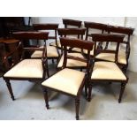 A set of eight mahogany Sheraton-style reproduction dining chairs (two carvers) and a mahogany