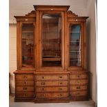 A late 19th century oak library break-front bookcase,