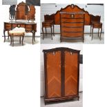 A reproduction French-style bedroom suite comprising two double-door wardrobes,