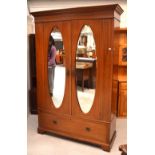 An Edwardian mahogany inlaid two-door wardrobe,