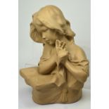 A plaster cast bust of a young girl reading music, marked 'Verde by Austin Productions Inc 1975',