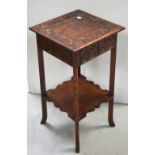 An Oriental hardwood side table on tapering supports, height 73cm.