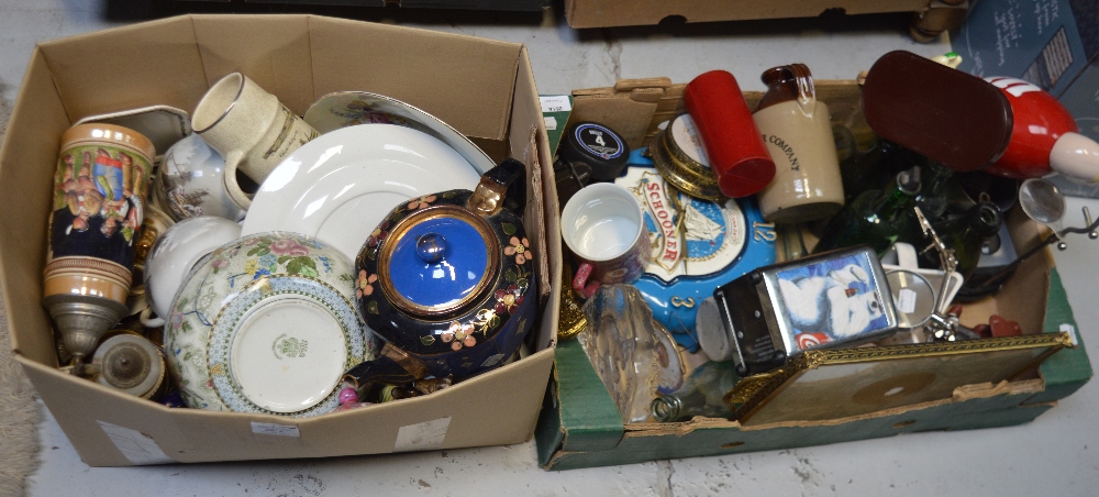 A box of collectibles to include vintage bottles, a glass paperweight with engraved squirrel,