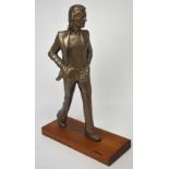 A bronzed resin figure of John Lennon on mahogany base, height 52cm.