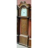 A 19th century and later carved oak longcase clock with broken swan neck pediment above arched