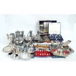 A large quantity of electroplated items to include a three piece tea set, a cruet stand,