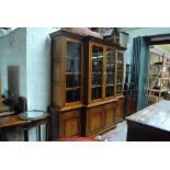 ANDREW KIDD; a reproduction oak breakfront bookcase,