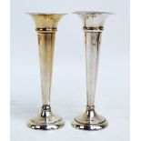 D BROSS; a pair of George V hallmarked silver trumpet vases with flared rims,