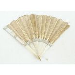 An early 20th century lace fan with mother of pearl sticks, length 30cm (af).