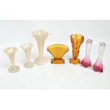 A set of three opalescent wide glass trumpet vases, height 23cm,