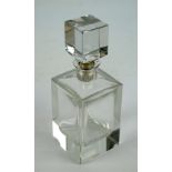 An Elizabeth II hallmarked silver collared and clear glass square section decanter, London 1975,