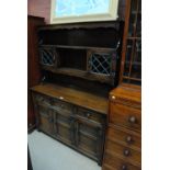 JAYCEE; a reproduction oak dresser with boarded leaded glazed plate rack, width 137cm.
