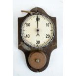 An early 20th century wall mounted one hour mechanical time clock, diameter 12.