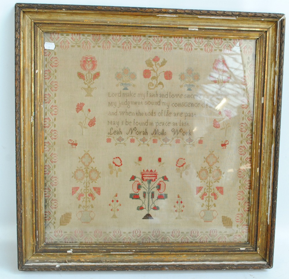 A 19th century large sampler with a religious verse,
