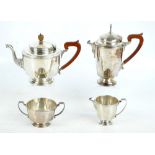 ADIE BROS; a George V hallmarked silver Art Deco four piece tea set of octagonal panelled form,