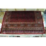 A red ground Bokhara carpet, 280 x 200cm.