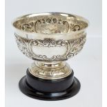 CHARLES STUART HARRIS; a large Edwardian hallmarked silver repoussé decorated pedestal bowl,