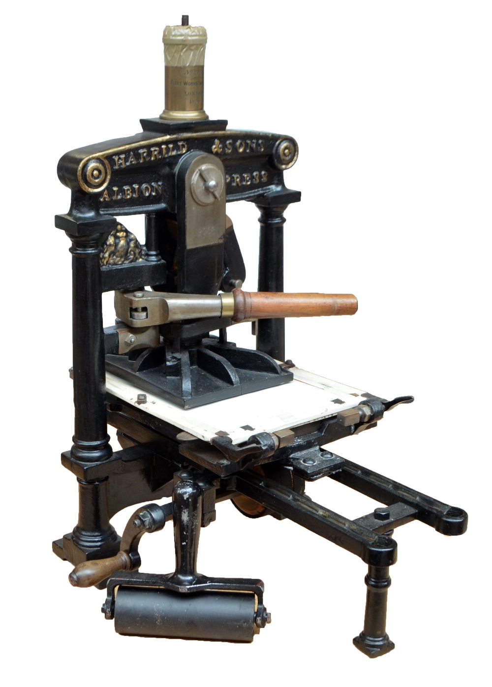 A large brass detailed and cast iron black painted press with twin wooden handles 'Harrild & Sons,