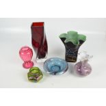 Six pieces of decorative glass including a square section wrythen ruby and clear glass vase,