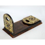 A mid-Victorian burr walnut and brass set adjustable book slide set with polished stone cabochons,