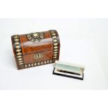 A Victorian walnut and strap bound and stud decorated dome top trinket box and a boxed Parker