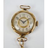 A gold filled lady's wristwatch, the circular cream and gold dial set with Arabic numerals,