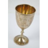 A George V hallmarked silver goblet of plain form with urn shaped bowl and moulded rim on a knopped