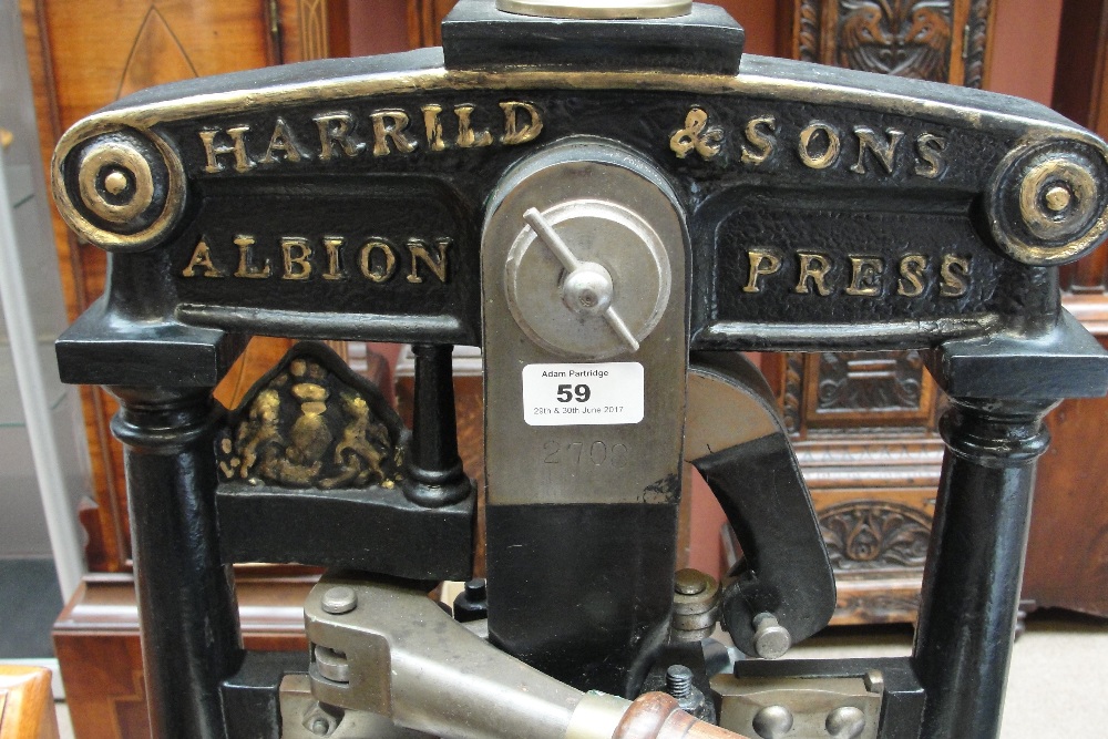 A large brass detailed and cast iron black painted press with twin wooden handles 'Harrild & Sons, - Image 3 of 3