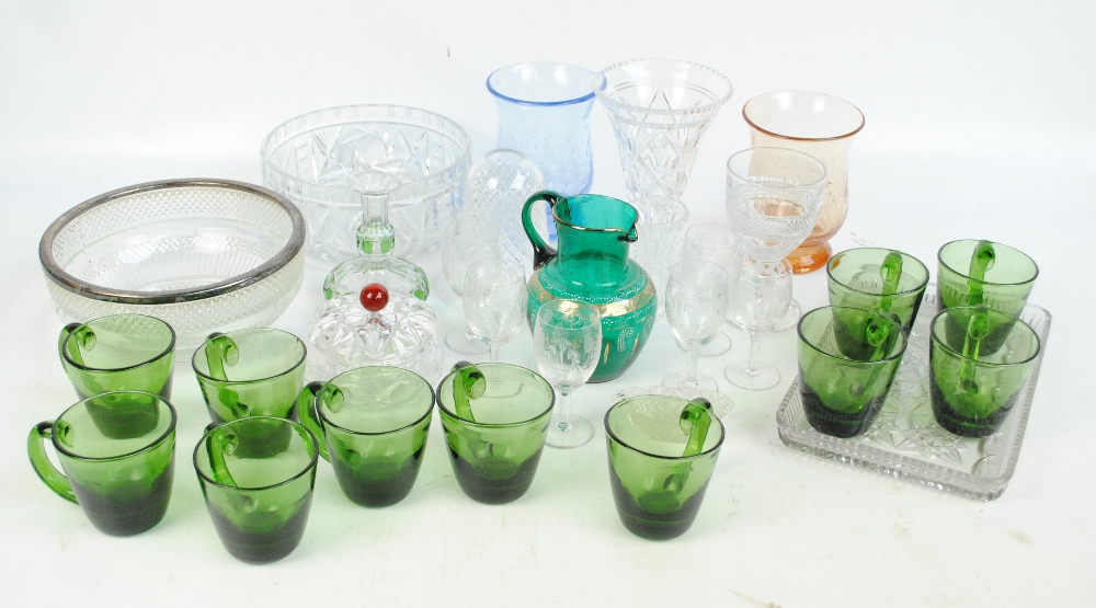 A quantity of mixed glassware including a green over-painted jug, a cut glass circular bowl,