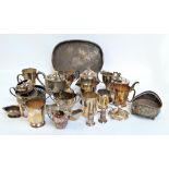 A quantity of silver plate including mugs, chamber stick, tea pot, toast rack, trophy cups, etc.