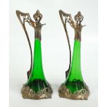 WMF; a large pair of silver plated and green glass Art Nouveau ewers, each with pierced stoppers,