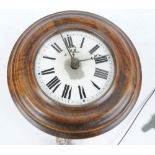 An early 20th century mahogany circular chain driven wall mounted alarm clock,