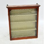 An Edwardian mahogany wall hanging display cabinet with single glazed door enclosing four shelves