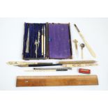 Two bone handled quill pens and a carved nib case with a Stanhope,