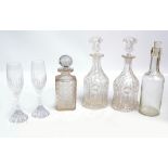 A small collection of glass decanters including a hobnail cut example,