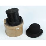 A black bowler hat and cardboard boxed top hat (2).