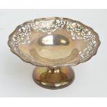 A George V hallmarked silver pedestal bowl with pierced shaped rim,