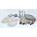 A quantity of silver plate to include two pairs of candlesticks with foliate scroll decoration,
