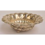 An early 20th century Austrian silver shaped circular gadrooned bowl with hammered body on three